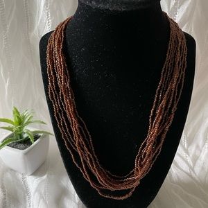Dark brown multi strands seed beads necklace.